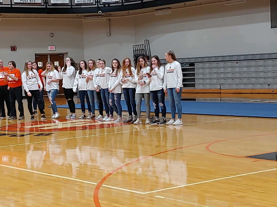 line of girls in white shirts